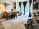 Bright dining area with a round table, banquette seating, and large windows, creating a cozy and inviting atmosphere at , McCordsville, IN 46055