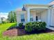 Charming brick home featuring a cozy front porch and well-maintained landscaping, complete with mulch and shrubbery at , McCordsville, IN 46055