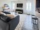 Stylish living room with modern decor that opens up to the eat in kitchen space at , McCordsville, IN 46055
