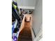 View of the basement stairs; access and storage at 5841 E Julian Ave, Indianapolis, IN 46219
