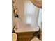 Cozy bathroom featuring a classic bathtub with shower curtain, and pedestal sink at 5841 E Julian Ave, Indianapolis, IN 46219