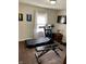 Inviting home gym with carpeted floors, workout equipment, and natural light from the window at 5841 E Julian Ave, Indianapolis, IN 46219