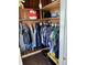 Organized closet with wooden shelves and ample storage space for clothes and accessories at 5841 E Julian Ave, Indianapolis, IN 46219