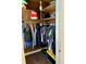 Organized closet with wooden shelves and ample storage space for clothes and accessories at 5841 E Julian Ave, Indianapolis, IN 46219