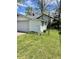 Exterior view of the detached garage, with yard at 5841 E Julian Ave, Indianapolis, IN 46219