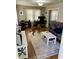 Bright living room featuring hardwood floors, a cozy sofa, and a large area rug at 5841 E Julian Ave, Indianapolis, IN 46219
