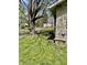 View of the side yard with tree shade, adjacent home view at 5841 E Julian Ave, Indianapolis, IN 46219