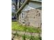 Landscaped side yard with small trees, well maintained at 5841 E Julian Ave, Indianapolis, IN 46219