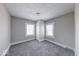 Bright bedroom with two windows and soft carpeting, offering a peaceful personal retreat at 623 Arbor Ave, Indianapolis, IN 46221