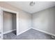 Bedroom with a neutral palette, enhanced by new carpet and a closet for storage at 623 Arbor Ave, Indianapolis, IN 46221