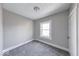 Neutral bedroom with a window and soft carpet, a serene space for rest and relaxation at 623 Arbor Ave, Indianapolis, IN 46221