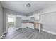 Modern kitchen with bright white cabinets, butcher block countertops, and sleek flooring at 623 Arbor Ave, Indianapolis, IN 46221