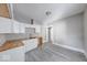 Updated kitchen showcasing bright cabinets, butcher block countertops, and modern gray flooring at 623 Arbor Ave, Indianapolis, IN 46221