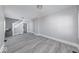 Bright and spacious living room featuring modern floors, neutral paint, and ample natural light at 623 Arbor Ave, Indianapolis, IN 46221