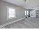 Open-concept living area with large windows and modern flooring, freshly painted and ready to enjoy at 623 Arbor Ave, Indianapolis, IN 46221