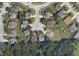 An aerial view displaying the house's location, backing onto a wooded area, in a well-established neighborhood at 6231 Oak Limb Ct, Indianapolis, IN 46221