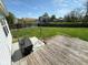 The backyard is accessible from the wooden deck, providing easy access for outdoor gatherings and relaxation at 6231 Oak Limb Ct, Indianapolis, IN 46221