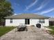 A view of the backyard with the home's back exterior and a wooden deck, perfect for outdoor activities at 6231 Oak Limb Ct, Indianapolis, IN 46221