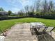 A wooden deck overlooks the expansive backyard, an ideal space for relaxing and outdoor gatherings at 6231 Oak Limb Ct, Indianapolis, IN 46221