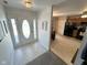 Bright entryway with tiled floors and direct sightlines into the kitchen area at 6231 Oak Limb Ct, Indianapolis, IN 46221