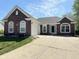 Charming single-story brick home featuring a well-manicured lawn and inviting curb appeal at 6231 Oak Limb Ct, Indianapolis, IN 46221