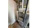 Close-up of the furnace, hot water tank, and vents in the basement of the property at 6231 Oak Limb Ct, Indianapolis, IN 46221