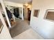 View of the hall with carpet flooring, an antique grandfather clock, and white walls at 6231 Oak Limb Ct, Indianapolis, IN 46221