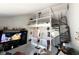 Open-concept living room featuring a spiral staircase and a second-story overlook at 6231 Oak Limb Ct, Indianapolis, IN 46221