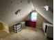 Attic space with sloped ceilings and carpeted floors at 658 Chestnut St, Noblesville, IN 46060