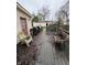 View of a covered deck with patio furniture, some grills, and some fallen leaves scattered about at 658 Chestnut St, Noblesville, IN 46060