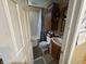Bathroom with tub, shower, wood vanity, sink and toilet at 658 Chestnut St, Noblesville, IN 46060