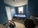 Bedroom with blue walls, carpet and natural light at 658 Chestnut St, Noblesville, IN 46060