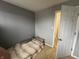 Small bedroom with beige carpet and gray walls at 658 Chestnut St, Noblesville, IN 46060