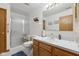 Well-maintained bathroom featuring a glass-enclosed shower, ample vanity space, and clean, neutral tones at 6640 S New Jersey St, Indianapolis, IN 46227