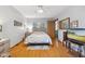 Serene bedroom featuring hardwood floors, neutral walls, and ample natural light, creating a calming ambiance at 6640 S New Jersey St, Indianapolis, IN 46227