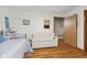 Cozy bedroom featuring hardwood floors, soft lighting, and a comfortable bed, creating a relaxing atmosphere at 6640 S New Jersey St, Indianapolis, IN 46227