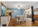 Cozy dining room with rustic wood table, stylish lighting, and plenty of natural light at 6640 S New Jersey St, Indianapolis, IN 46227