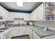 Functional kitchen with white cabinets, modern appliances, and durable countertops, perfect for cooking and meal preparation at 6640 S New Jersey St, Indianapolis, IN 46227