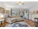 Cozy living room with large window, hardwood floors and a comfortable sofa at 6640 S New Jersey St, Indianapolis, IN 46227