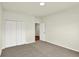 Neutral bedroom with carpet, spacious closet, and doorway to another room at 7136 Jackson Dr, Cumberland, IN 46229