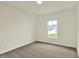 Carpeted bedroom featuring a window letting in natural light at 7136 Jackson Dr, Cumberland, IN 46229
