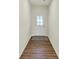 Entryway featuring hardwood floors, white walls, and a white door with a window at 7136 Jackson Dr, Cumberland, IN 46229