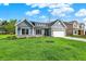 Charming single-Gathering home featuring stone accents and a two-car garage at 7136 Jackson Dr, Cumberland, IN 46229