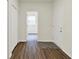 Hallway with wood floors and a view into another room at 7136 Jackson Dr, Cumberland, IN 46229