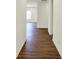 Hallway features hardwood floors, white walls, and leads into other rooms at 7136 Jackson Dr, Cumberland, IN 46229