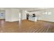 Bright open-concept living room and kitchen with hardwood floors at 7136 Jackson Dr, Cumberland, IN 46229