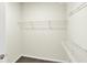 Walk-in closet with carpeted floor and wire shelving at 7136 Jackson Dr, Cumberland, IN 46229