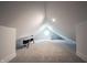 Finished attic offers carpeting, storage and natural light from geometric window at 722 E Minnesota St, Indianapolis, IN 46203