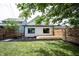The home boasts a charming backyard with a wooden deck, perfect for relaxing or entertaining friends and Gathering at 722 E Minnesota St, Indianapolis, IN 46203