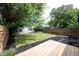 A spacious backyard provides a serene retreat, complemented by a wooden deck ideal for outdoor gatherings at 722 E Minnesota St, Indianapolis, IN 46203